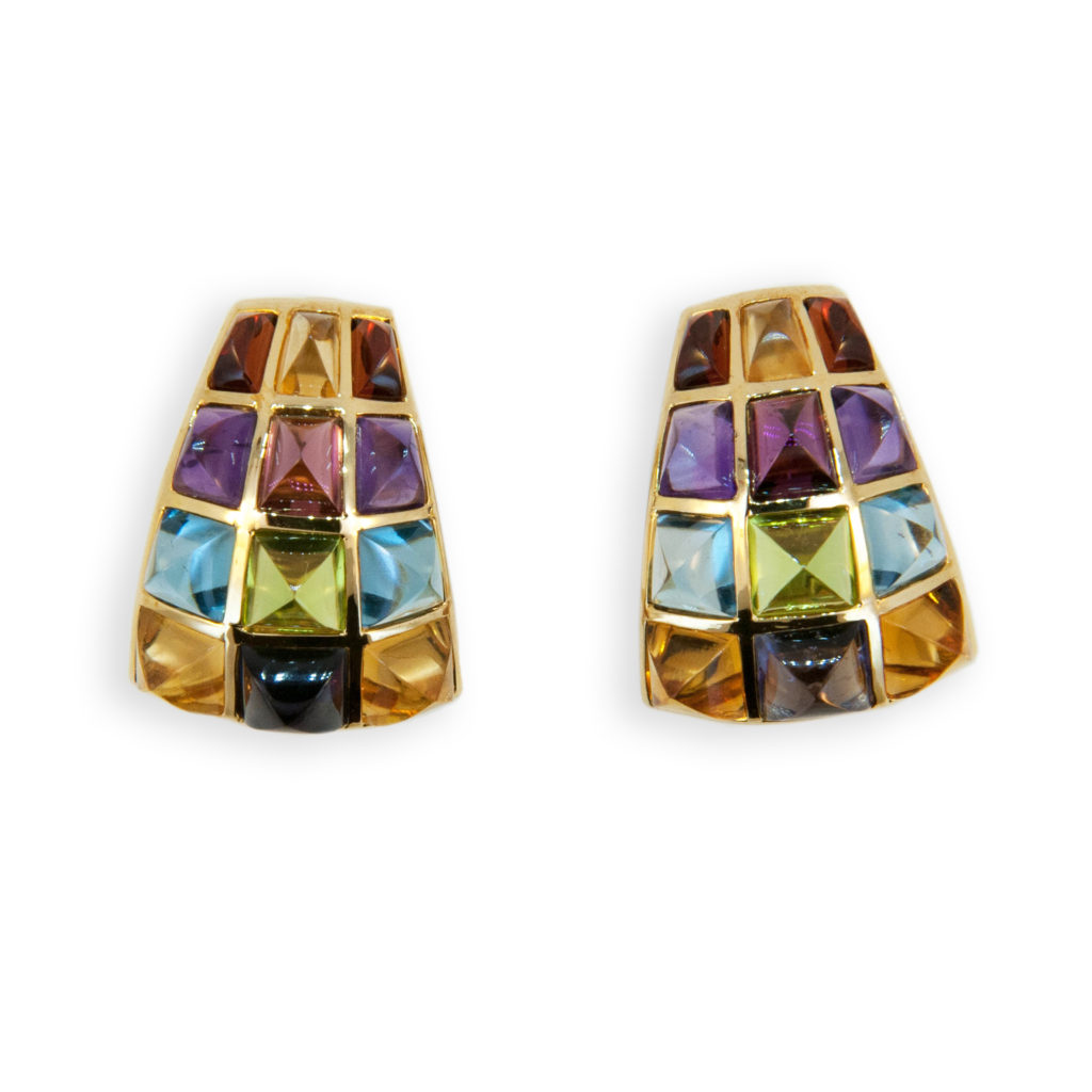Classic Laura Munder clip on gemstone earrings created using fashion colors to coordinate with every outfit. 18K yellow gold earring set with sugarloaf cut peridot, iolite, citrine, blue topaz, amethyst, garnet, pink tourmaline. Omega clip backs posts could be added. Tapered shape hugs the ear and flatters every face.