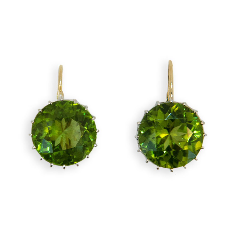 18 karat white gold and yellow gold wire earring round faceted Peridot 13.5 millimeters 18.44 carats total weight. Multi-prong white gold basket with yellow gold wires. Leverbacks.