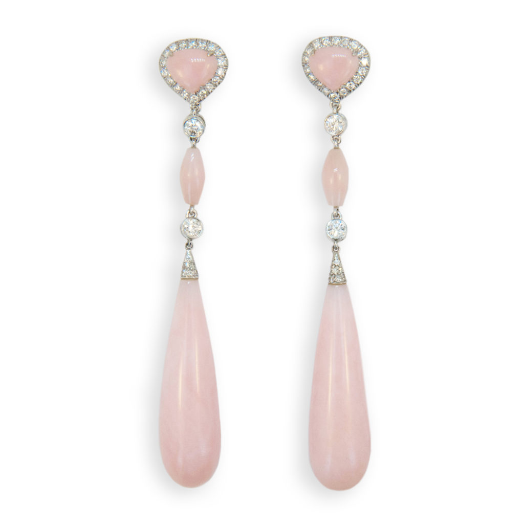 Delicate but Important, Pink Opal and diamond earrings by Laura Munder. 18k white gold dangle earrings each set with (1) long Pink Opal drop (2)=approx. 36.18cts.twt., (1) pear shape and (1) elongated bead (4)=approx. 3.55cts.twt. also set with (2) round Diamonds (4)=approx. .34ct.twt. and (34) round diamonds (68)=approx. .48ct.twt. For pierced ears.