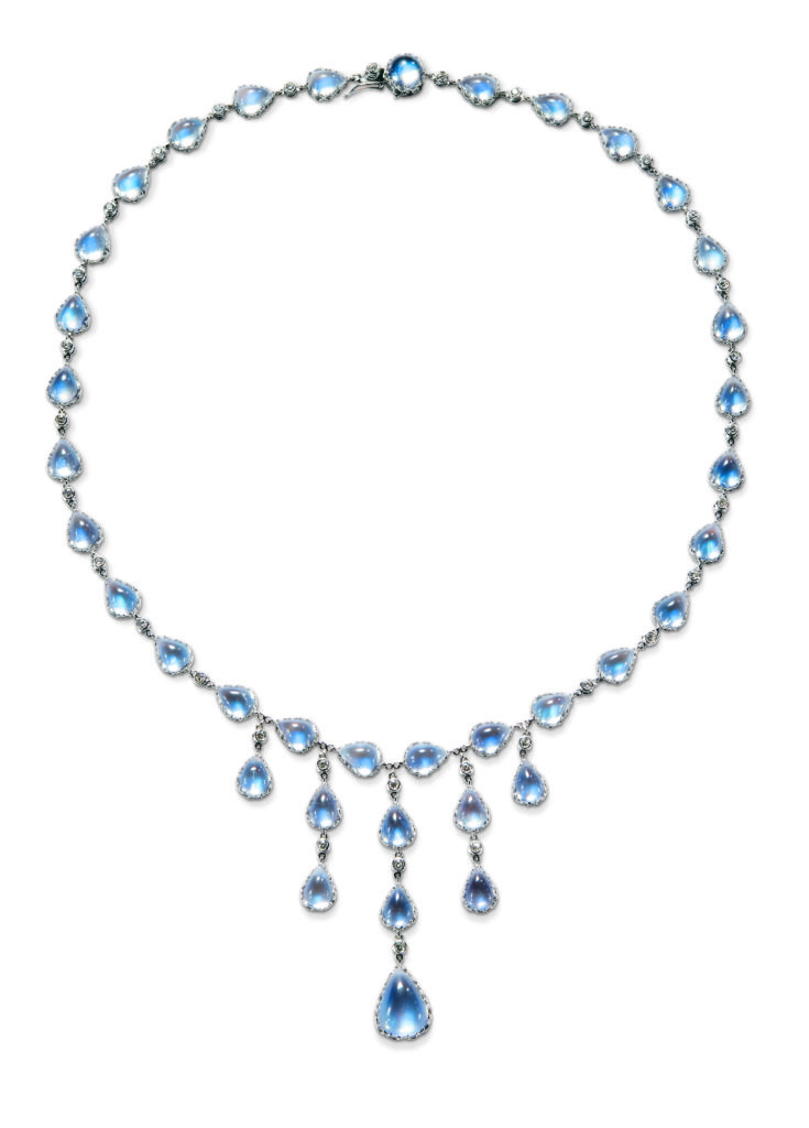 18 karat white gold necklace, Moonstone and diamonds. (38) 8 x 6 mm pear shape moonstones 37.34 carats (1) 13 x 8.8 mm pear shape 3.83 carats and one 7 mm round 1.23 carat at clasp (35) 2 mm round diamonds bezel set 1.01 carats. Necklace is 16.5 inches long, with center Moonstone drop extending down and additional 2 inches. Moonstones have a beautiful blue sheen.
