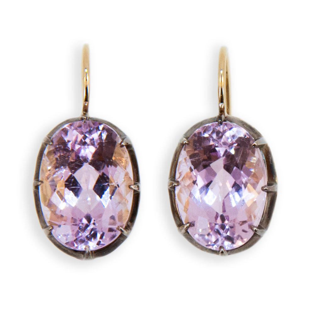 18 karat yellow gold and blackened sterling silver on a wire earrings each set with one oval Kunzite measuring approximately 13.8 x 9.8 mm. 13.74 carats total weight. Leverbacks.