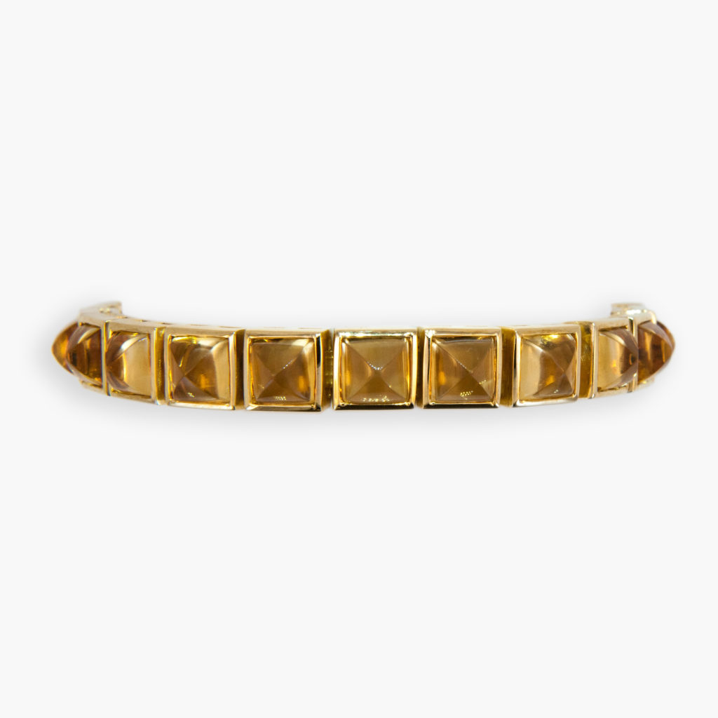 18K yellow gold sugarloaf cut citrine line bracelet. 7 1/8 inches long.