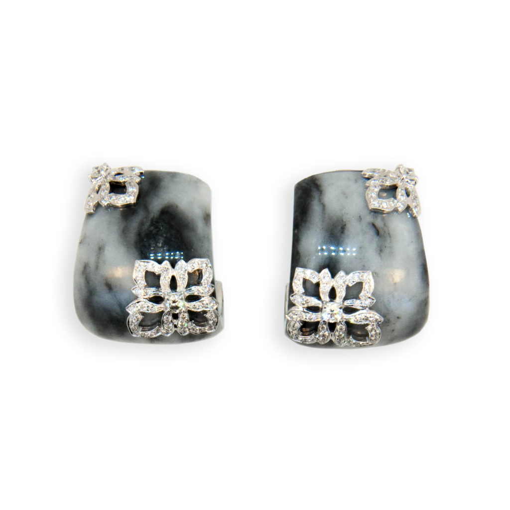 18 karat white gold earrings J shaped hoop Zebra print Jade with raised diamond design at opposite corners set with 118 diamonds (59 each earring) total 1.03 carats total weight. Posts with omegas.