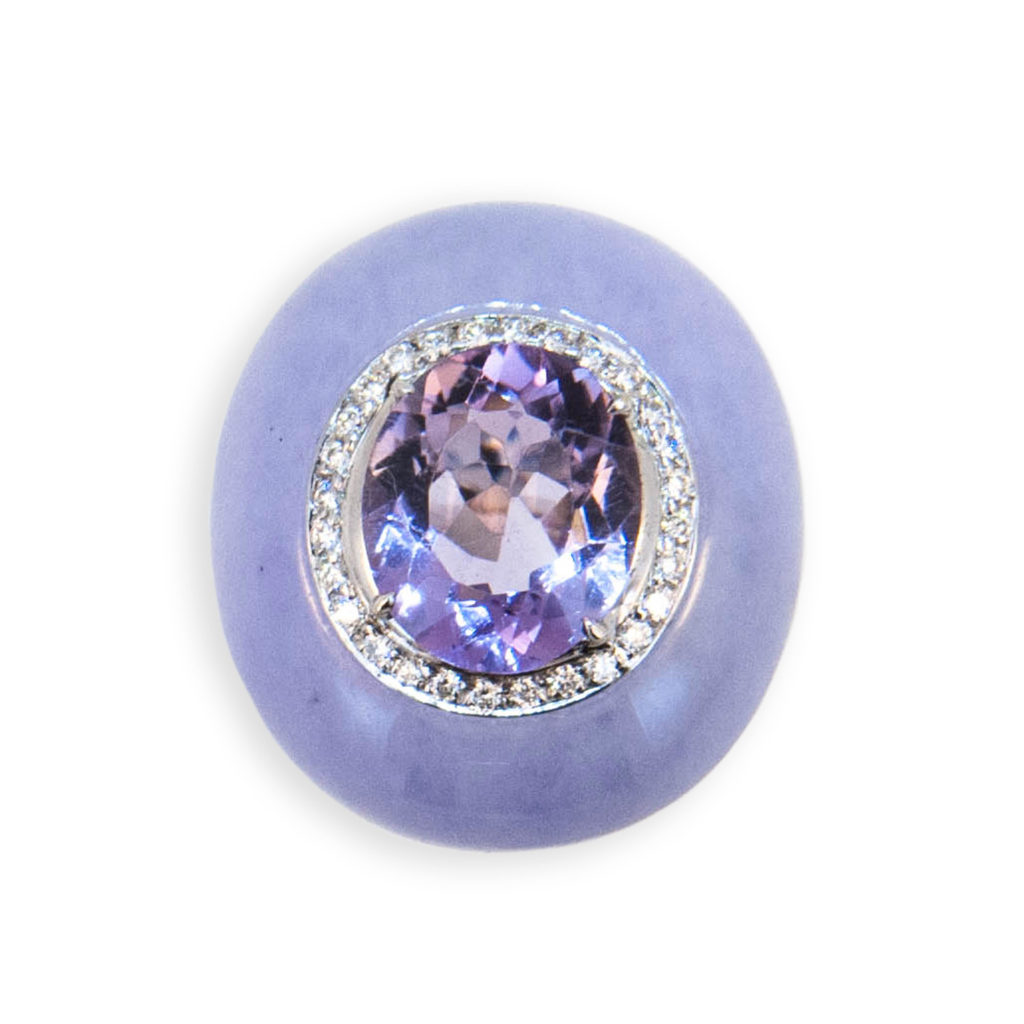 18 karat white gold ring set with one oval amethyst approximately 3.84 carats surrounded by (28) micro-set diamonds , split shank is set with (56) diamonds (84) Diamonds total 1.12 carats total weight Amethyst and surrounding diamonds are set into an oval piece of Lavender Jade. Size 6.