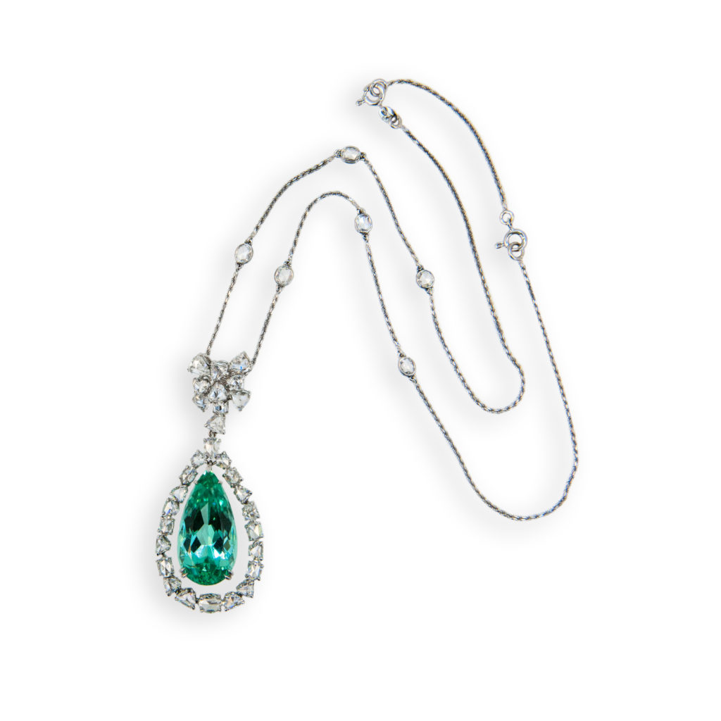 Laura Munder 18 karat blackened white gold necklace set with one faceted pear shaped Mint Green Tourmaline weighing 17.94 carats. Encompassing the Tourmaline are 30 fancy shaped rose cut diamonds and six oval rose cut diamonds bezel spaced throughout the chain. Total weight of the 36 Diamonds is 5.48 carats total weight. Chain is 16 inches plus a 2 inch extension.
