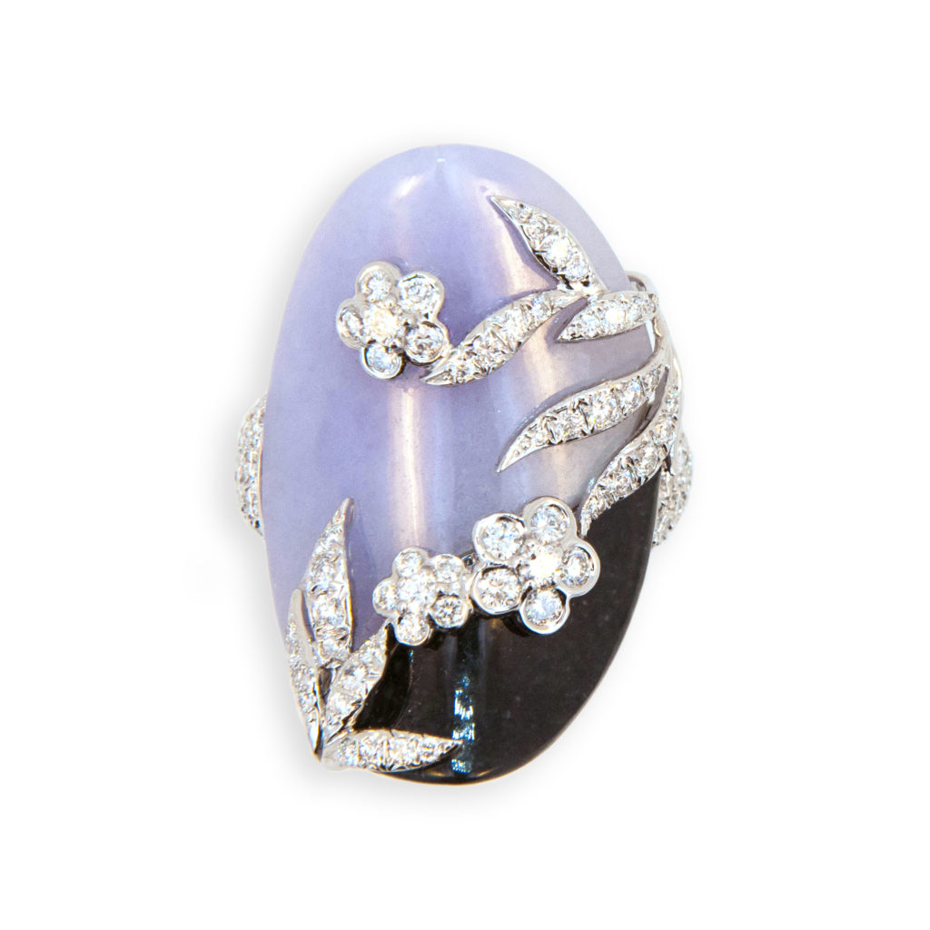 18 karat white gold ring oval curved Lavender and Black Jade with raised flower and leaf design set with diamonds, shank is pave' set with diamonds 143 diamonds 2.10 carats total weight. Size 7 plus with a horseshoe.