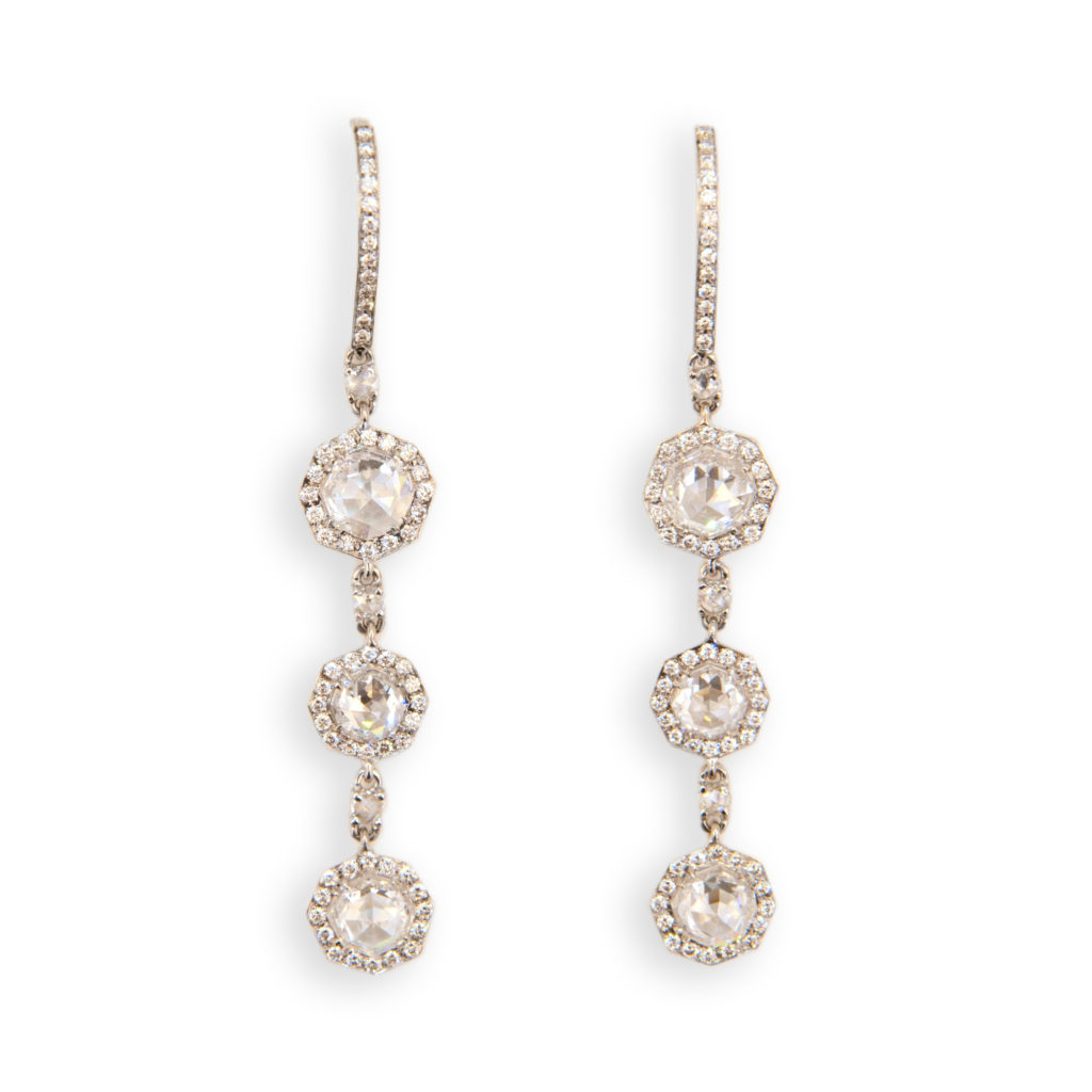 18 karat white gold drop earrings each with three octagonal sections each set with one octagonal rose cut diamond (6) have total weight of 2.54 carats surrounded by micro-set diamonds (96) total .48 carat total weight. Wire at top set with (13) micro-set diamonds (26) total .10 carat total weight. Wire and each link separated by one round rose cut diamond (6) total .19 carat total weight. Total weight of all diamonds is 3.31 carats total weight.