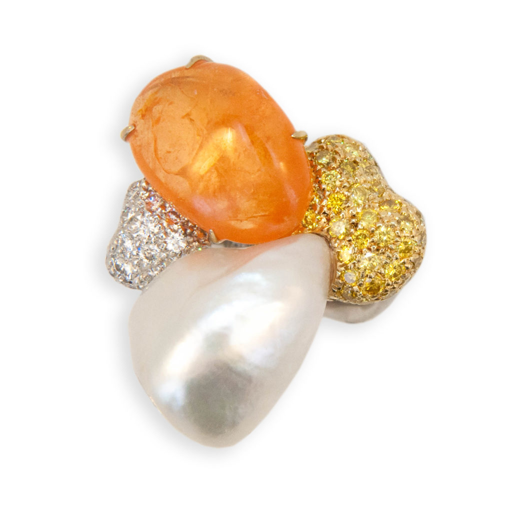 18 karat yellow and white gold ring freeform tumble polished Mandarin Garnet 19.18 carats. White Keshi Pearl 3.69 grams (41) Yellow Diamonds .98 carat (37) Round white diamonds .81 carat. Ring is a size 6.5.