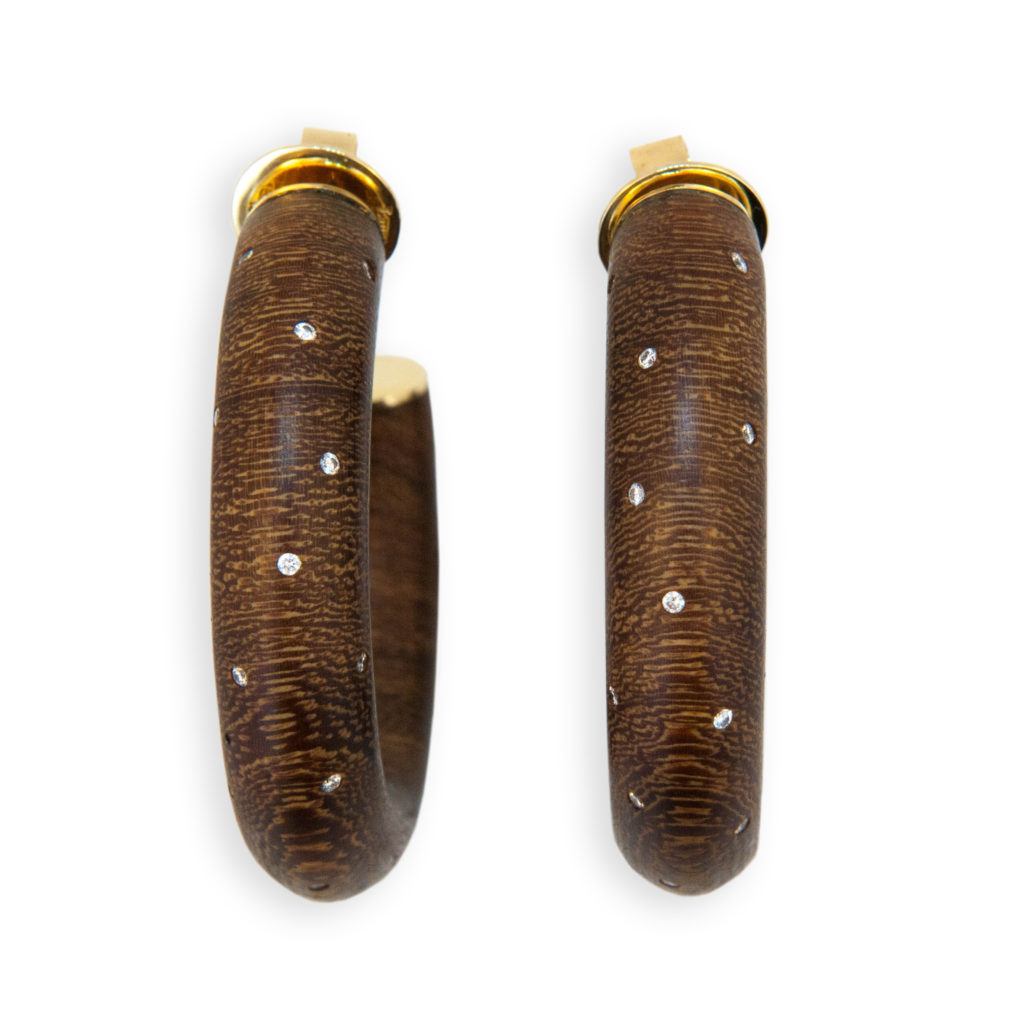 18 karat yellow gold and Wood three quarter hoop earrings, each set with 18 Diamonds .35 carat total weight. Posts.