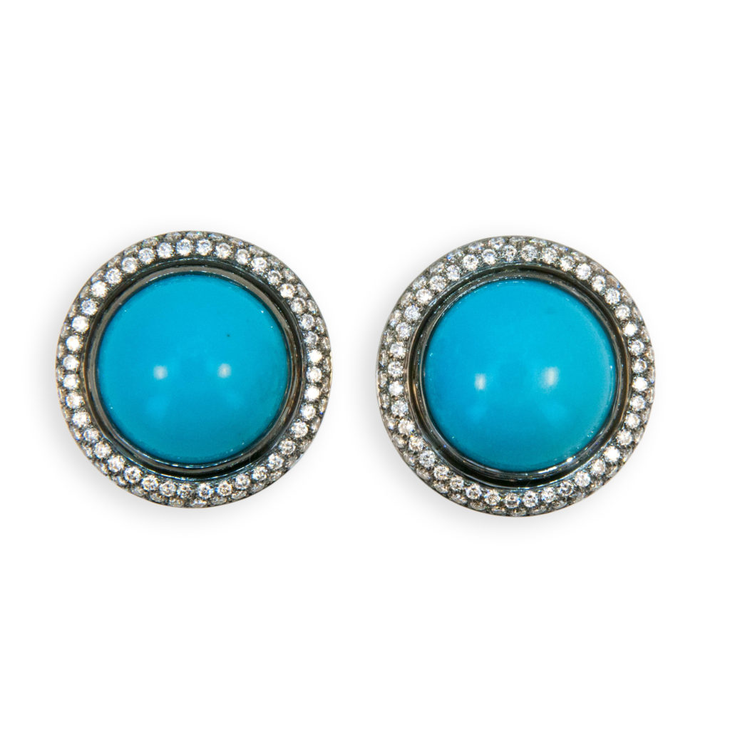 18 karat yellow blackened gold turquoise and diamond earrings. Round cabochon turquoise approximately 21.29 carats total weight. Diamonds approx. 1.59 carats total weight. Turquoise approximately 15 mm in diameter. Earrings can be worn as pierced or clip on posts fold down.