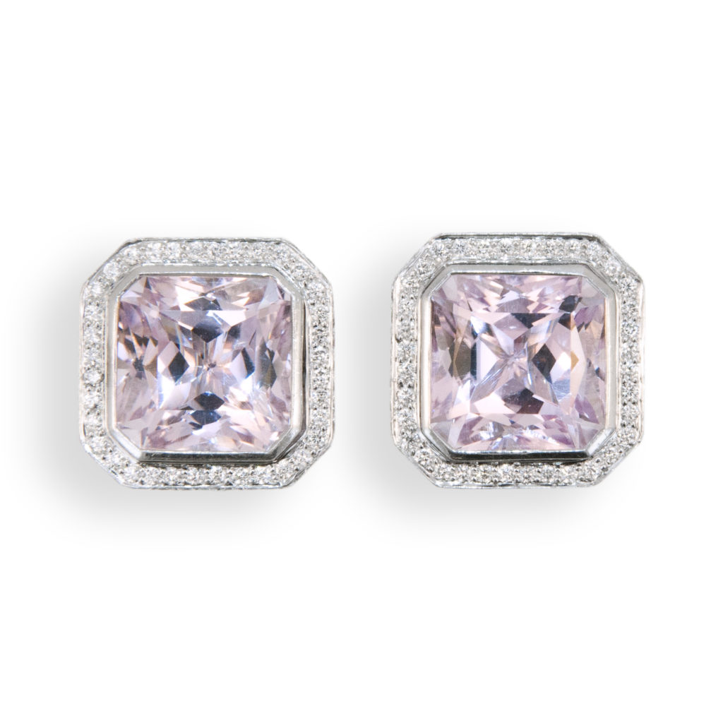 18 karat white gold earrings set with octagonal Kunzite 21.83 carats total weight. Surrounde by 232 round micro-set diamonds 1.93 carats total weight. May be worn as clips or pierced, posts fold down.